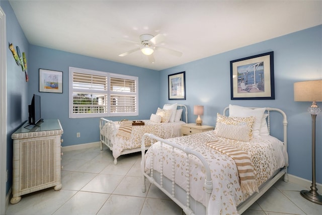 tiled bedroom featuring ceiling fan