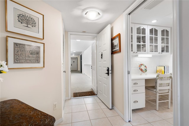 hallway with light tile patterned floors