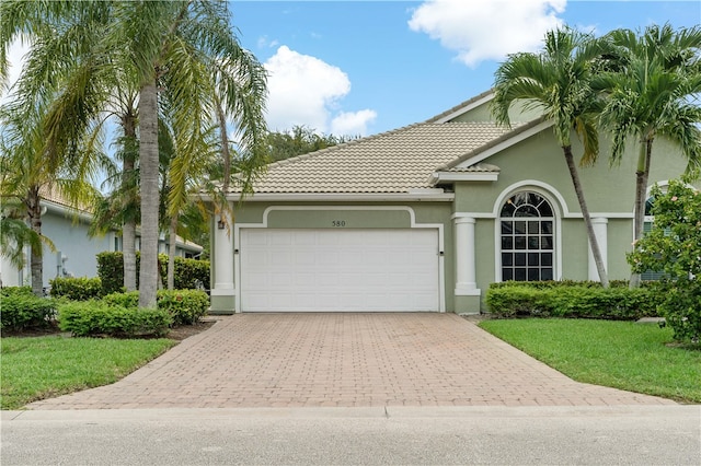 view of front of property featuring a garage