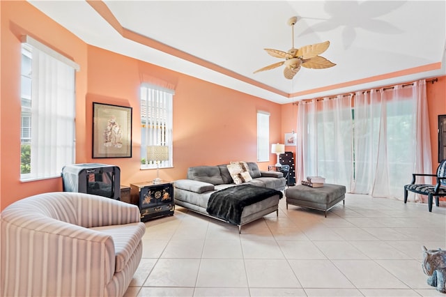 tiled living room featuring a wealth of natural light and ceiling fan