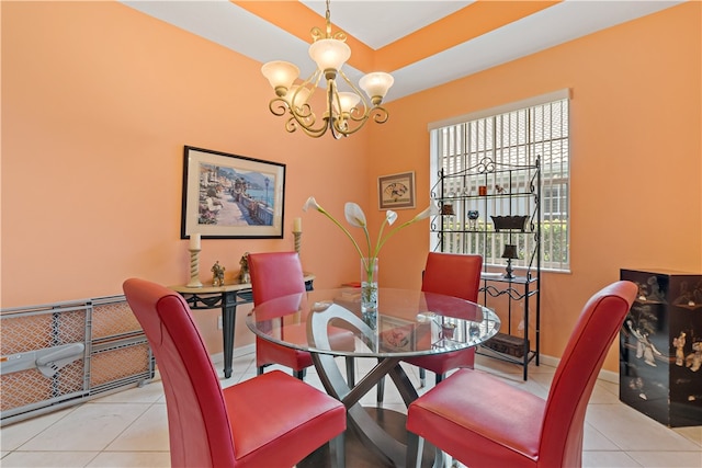 dining area featuring a notable chandelier and light tile patterned flooring