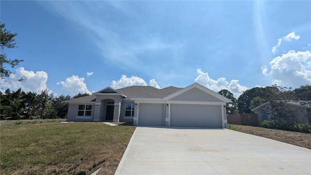 498 Easy St, Sebastian, FL 32958 - ranch-style house with an attached garage, concrete driveway, and stucco siding