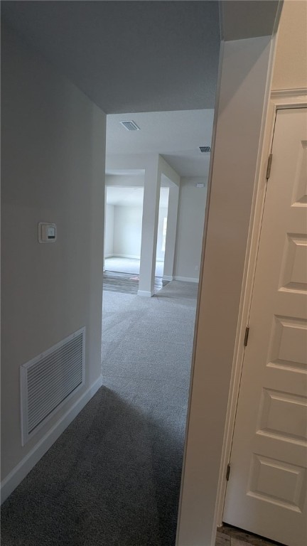498 Easy St, Sebastian, FL 32958 - hallway with carpet and baseboards