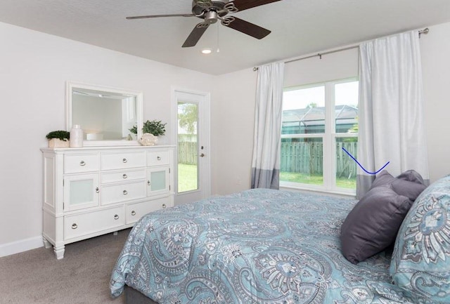 bedroom with baseboards, a ceiling fan, and dark colored carpet