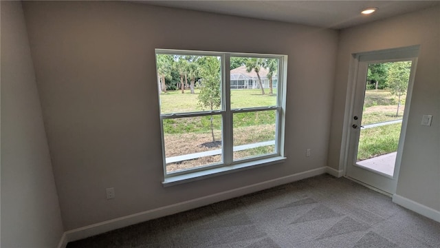 498 Easy St, Sebastian, FL 32958 - spare room featuring plenty of natural light, baseboards, carpet flooring, and recessed lighting