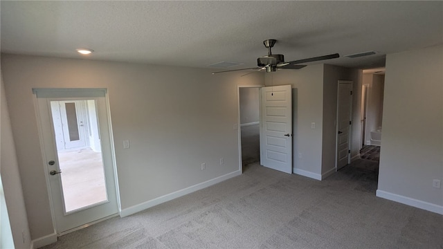 498 Easy St, Sebastian, FL 32958 - unfurnished bedroom featuring carpet floors, baseboards, a textured ceiling, and ceiling fan