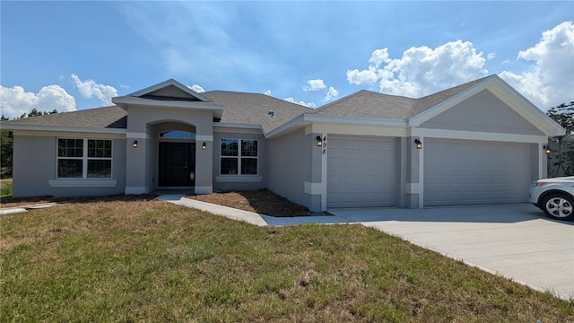 498 Easy St, Sebastian, FL 32958 - single story home with a garage, stucco siding, driveway, a front yard, and a shingled roof