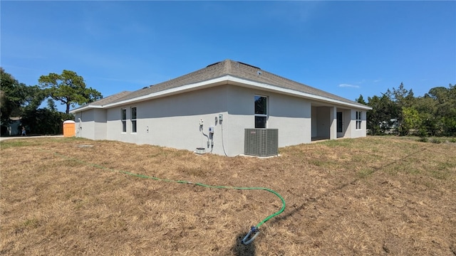 498 Easy St, Sebastian, FL 32958 - view of side of property with central AC unit and stucco siding