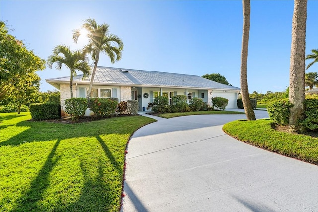 ranch-style house with a front yard and driveway