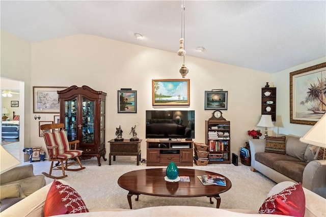 carpeted living room with vaulted ceiling