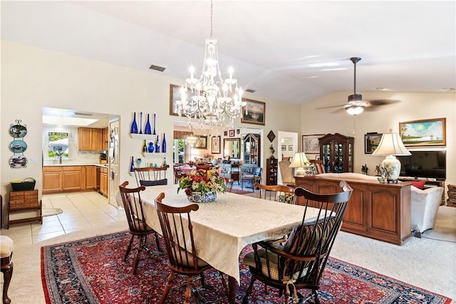 dining room with visible vents, lofted ceiling, light tile patterned flooring, and a ceiling fan