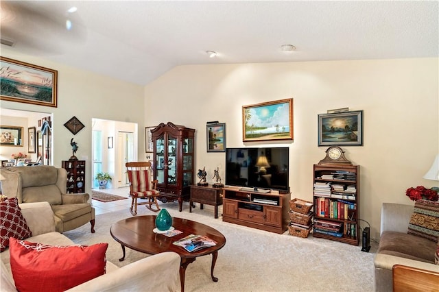 living room with vaulted ceiling and light colored carpet