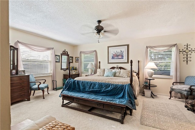 bedroom featuring multiple windows, carpet, and a ceiling fan