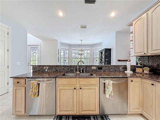 105 Charleston Oaks Dr, Port St Lucie, FL 34983 - kitchen with dishwasher, light brown cabinets, a sink, plenty of natural light, and recessed lighting