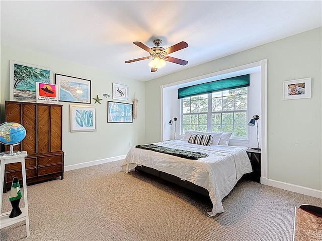 105 Charleston Oaks Dr, Port St Lucie, FL 34983 - bedroom with baseboards, light colored carpet, and a ceiling fan