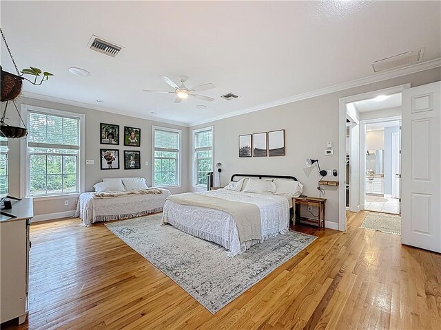 105 Charleston Oaks Dr, Port St Lucie, FL 34983 - bedroom with ornamental molding, light wood-style flooring, baseboards, and ceiling fan