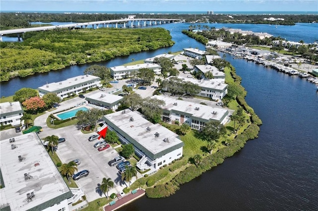 birds eye view of property with a water view