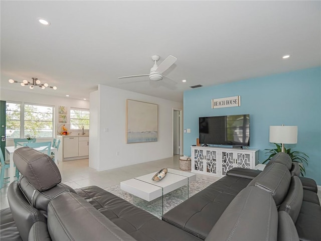 living room with visible vents, a ceiling fan, and recessed lighting