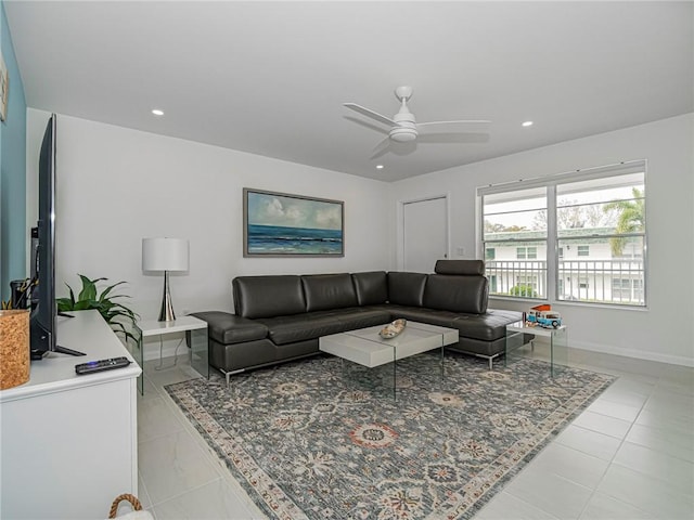 living room featuring a ceiling fan, recessed lighting, baseboards, and light tile patterned floors