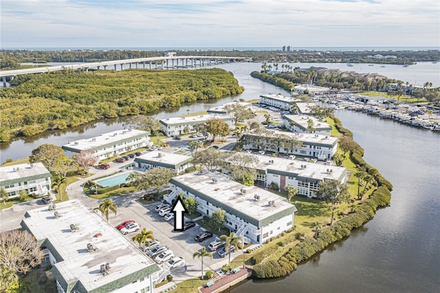 birds eye view of property with a water view