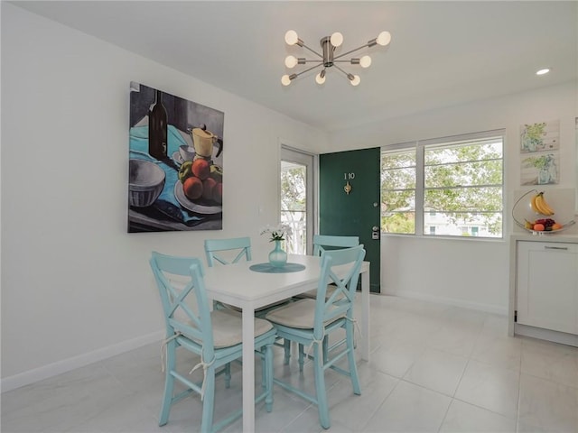 2800 Indian River Blvd Unit I10, Vero Beach, FL 32960 - dining room featuring a chandelier and light tile patterned floors