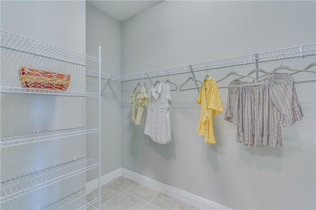 walk in closet with tile patterned flooring