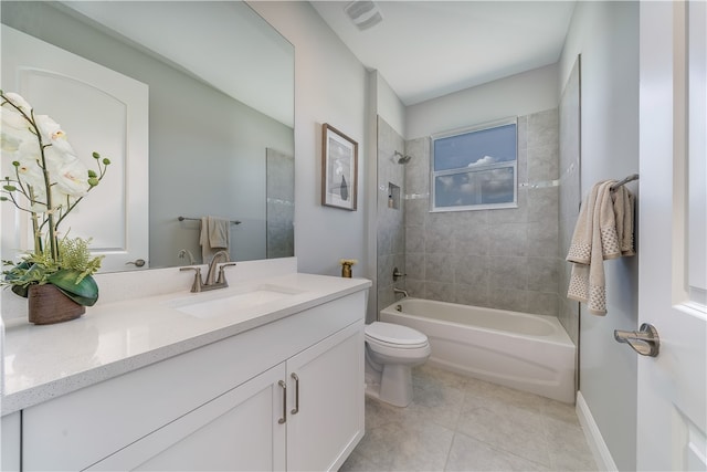 full bathroom with toilet, tiled shower / bath combo, vanity, and tile patterned floors