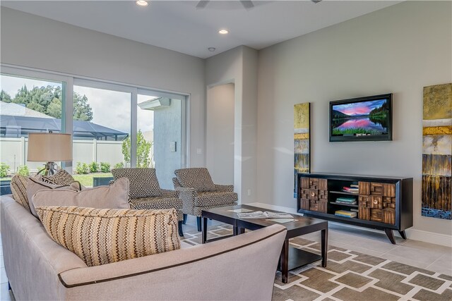 tiled living room featuring a wall mounted air conditioner