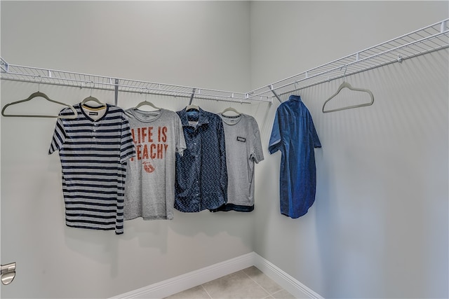 spacious closet featuring tile patterned flooring