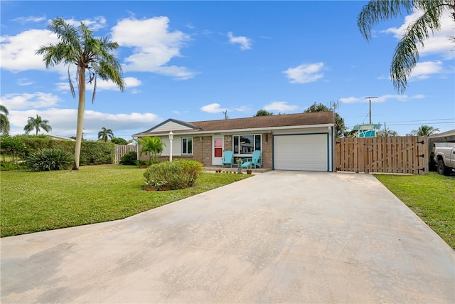 single story home featuring a garage and a front lawn