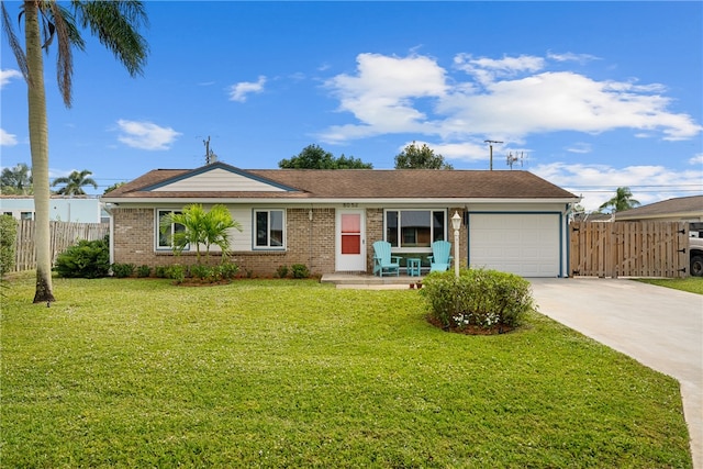 ranch-style home with a garage and a front lawn