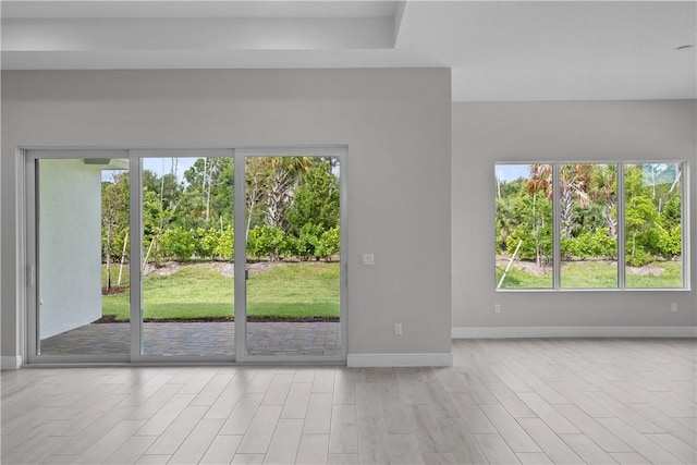 spare room with light hardwood / wood-style flooring