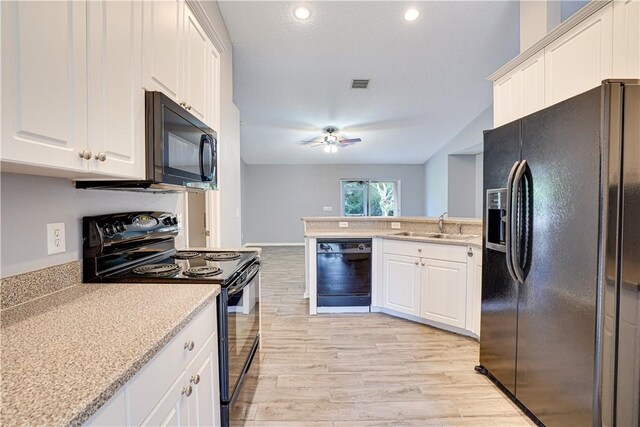 kitchen with black appliances, ceiling fan, white cabinets, and sink