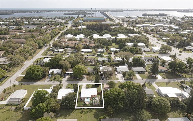 birds eye view of property featuring a residential view and a water view