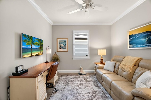 home office with ornamental molding, baseboards, and a ceiling fan