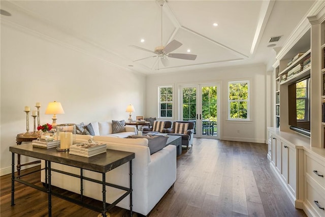 living room with ceiling fan, dark hardwood / wood-style flooring, crown molding, and french doors