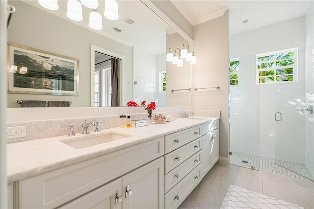 bathroom featuring ornamental molding, vanity, tile patterned floors, and a shower with shower door