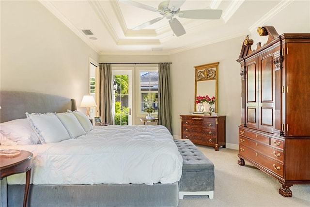 bedroom with ceiling fan, a raised ceiling, light carpet, and crown molding