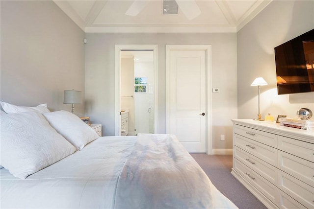 bedroom featuring ceiling fan, dark colored carpet, ensuite bathroom, vaulted ceiling, and ornamental molding