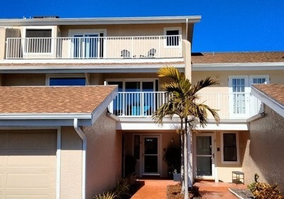 view of front of house with a garage and a balcony