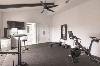 workout area with lofted ceiling and ceiling fan