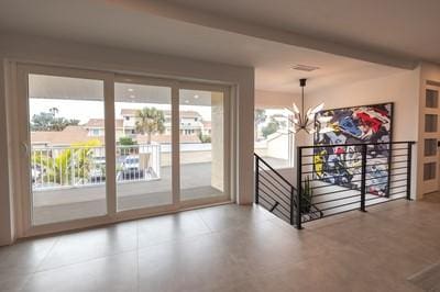 entryway featuring a notable chandelier