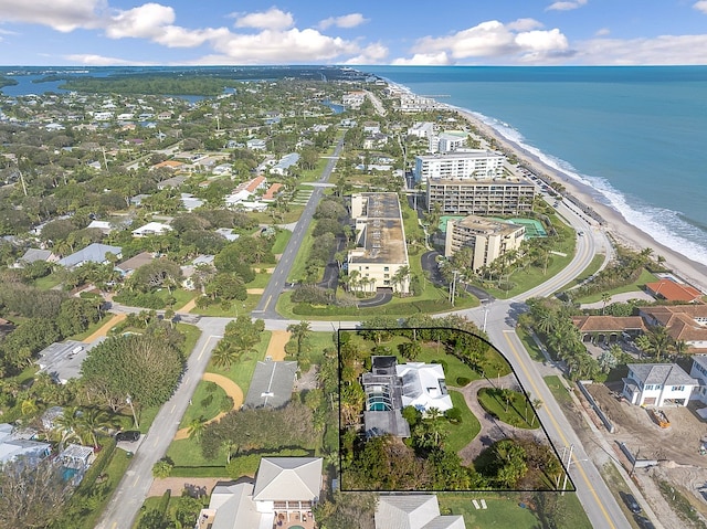 aerial view featuring a water view and a beach view