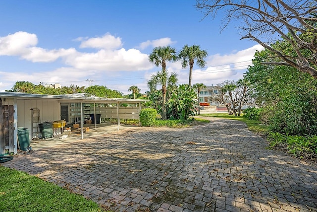 exterior space featuring a carport