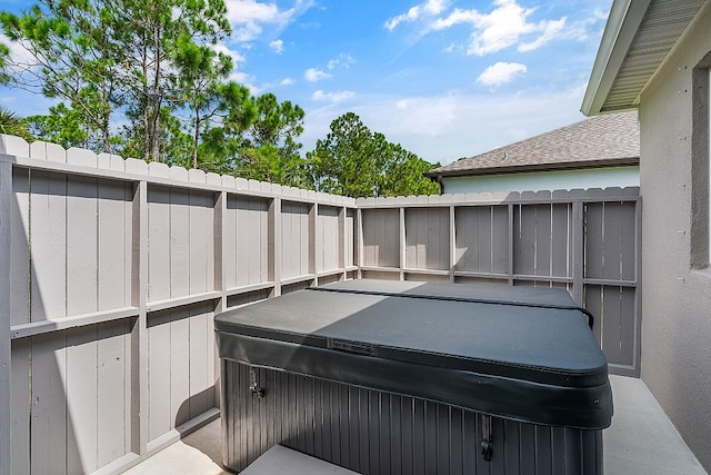 view of patio with a hot tub