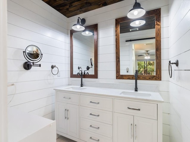 4750 10th St, Vero Beach, FL 32966 - bathroom with double vanity, wood walls, and ceiling fan