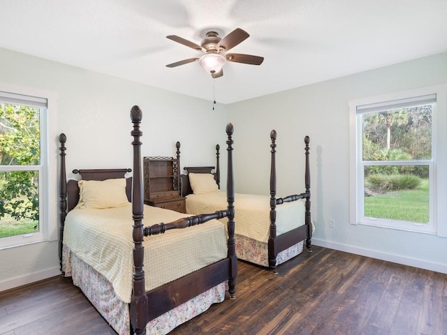 bedroom featuring ceiling fan and dark hardwood / wood-style floors