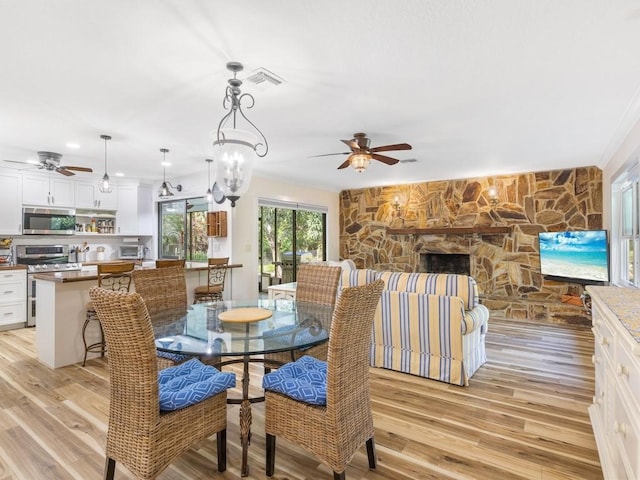 4750 10th St, Vero Beach, FL 32966 - dining area with a ceiling fan, light wood finished floors, and ornamental molding