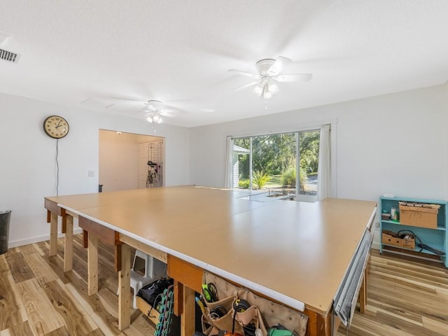 kitchen featuring ceiling fan and light wood-type flooring