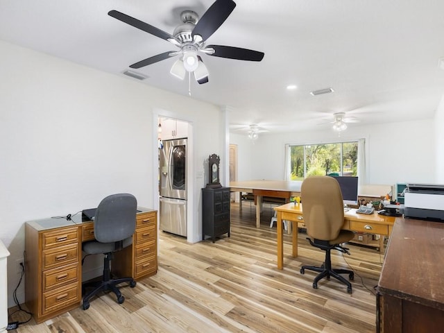 office space featuring ceiling fan and light hardwood / wood-style flooring